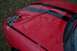 1993 Ford Probe - The front of a red car with black stripes shows significant damage on the hood.