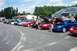 1993 Ford Probe - A red sports car is displayed with its hood open at an outdoor car gathering.