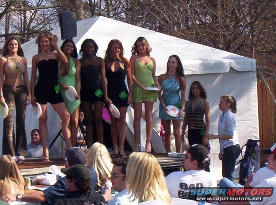 Women on a stage at an outdoor event