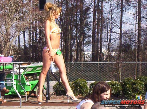 Woman in bikini walking on stage