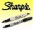 Two black Sharpie markers on a yellow gradient background
