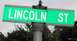 1998 Lincoln Mark VIII - A street sign indicates Lincoln Street, unrelated to any vehicle.