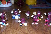 Bunch of raisin figures, one is playing drums, another is playing guitar