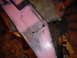 1981 Ford Bronco - A pink painted metal part is shown with scribe lines indicating cutouts and holes, possibly for modification or repair.