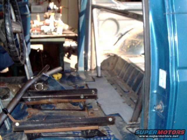 Frame supports tacked to steel plate, welded to the floor.