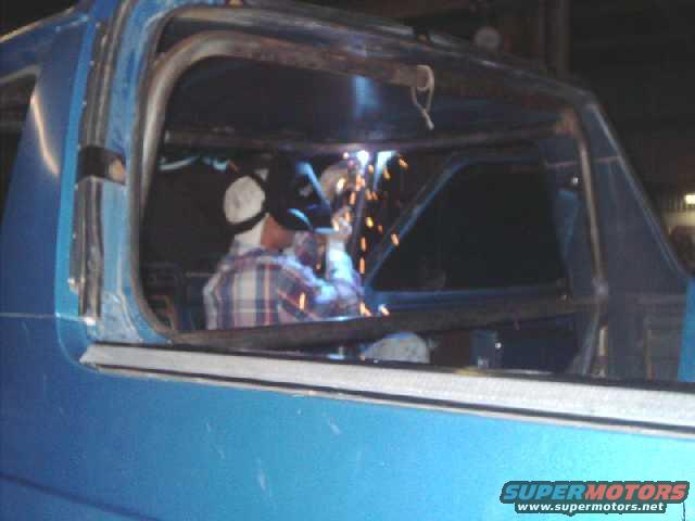 cagekit46.jpg Welding front post runner to roof hoop