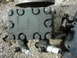 1978 Ford Bronco - Hydraulic pump part with visible 'DISCHARGE' and 'SUCTION' markings.