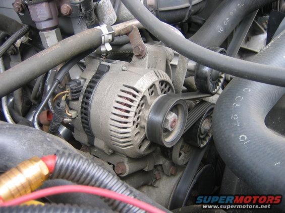 The old factory wasn’t malfunctioning, but it just didn’t have he juice to power all my stuff, especially if I ever drove with the headlights, defroster, and rear defroster on, and then add the stereo.  Not a good thing, here is the old one ready to come out.
