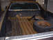 1972 Ford Ranchero - Interior of a 1972 Ford Ranchero pickup truck bed, showing a spare tire and some tools.