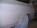 1972 Ford Ranchero - Side view of a 1972 Ford Ranchero undergoing bodywork, with primer applied.