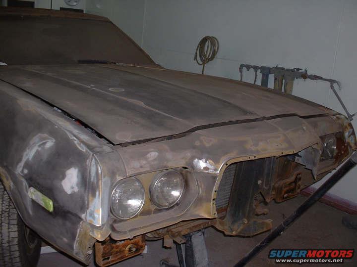 1972 Ford Ranchero front end with dual headlights and grille removed, in primer