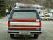 1990 Ford Bronco - This Ford Bronco features a distinctive red, white, and blue stripe pattern on its tailgate.