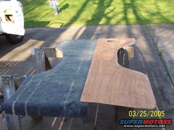 stapled on the back side. i coated both sides with adhesive and waited 10 min and flipped the fabric