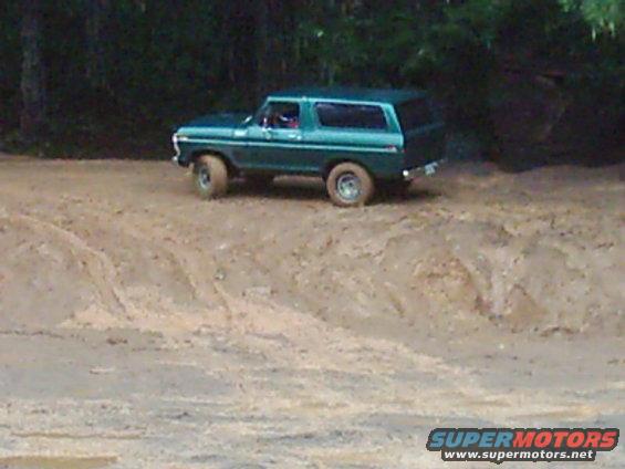 Green 1978 Ford Bronco on dirt path