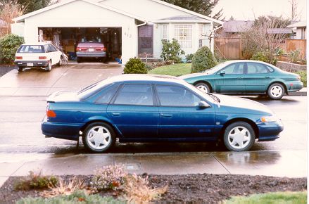 Blue sedan side view, 1990s model