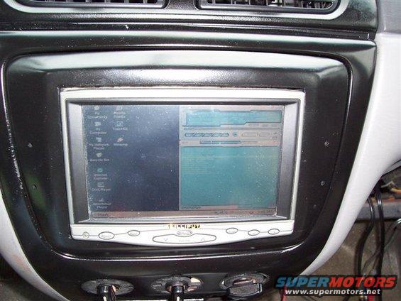 Aftermarket car computer screen displaying icons and a program interface