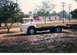 1957 Ford Deluxe - This truck chassis is missing its trailer and is parked in an outdoor lot.