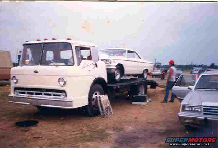 White 1961 car on car hauler truck, side view