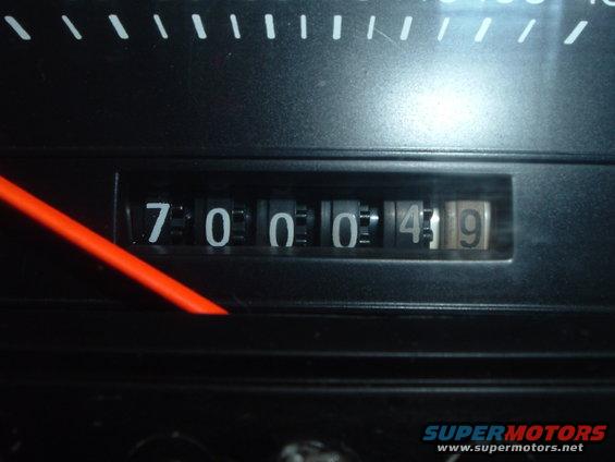 Odometer showing 700049 with a red needle pointing to the left