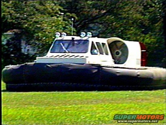 Hovercraft with large rear fan and inflatable skirt, seen from the side
