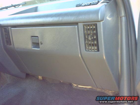 1990 Ford Bronco interior showing glove box and air vent