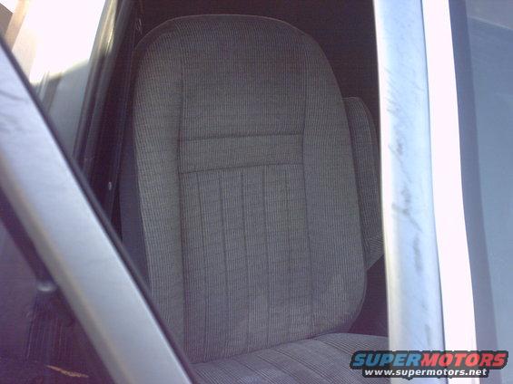 Gray striped fabric car seat interior, driver's side, with visible Supermotors.net watermark