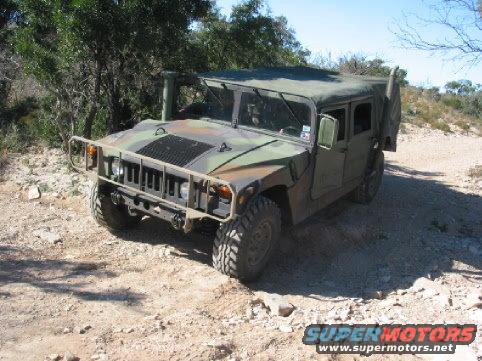 Camouflaged Humvee on dirt road