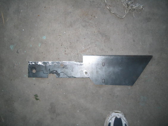 Metal bracket with cutouts and two holes