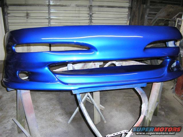 blue car bumper on sawhorses