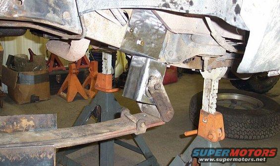 Front hanger for rear leafs roughed in.  3" square.  The two bolts pic'd are in pre-existing holes - every little bit helps make it go faster.  Need bushings
