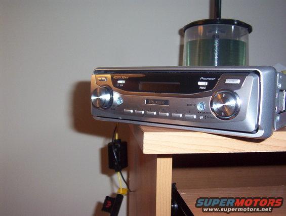 Pioneer car stereo with a CD case behind it