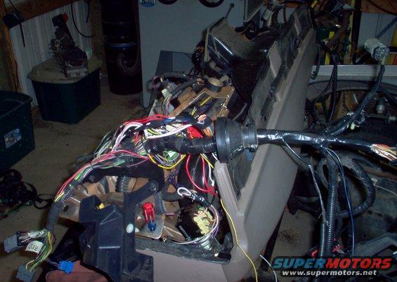 o05.jpg The RKE/start wiring has been soldered in (with a few minor modifications) and the FTP & CANV wires run thru the connectors in the lower L.  The RKE antenna will be placed much better along the windshield (small yellow wire in the lower center).