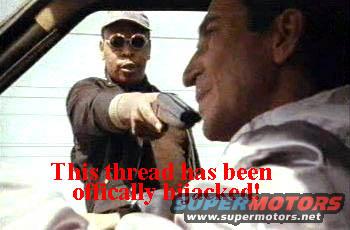 Two men inside a vehicle, one pointing a handgun at the other; text overlay says 'This thread has been officially hijacked!' and 'SUPERMOTORS'