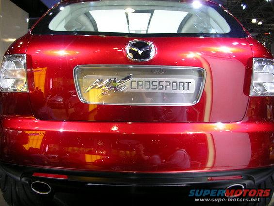 Red Mazda MX-Crossport rear with chrome badge and taillights