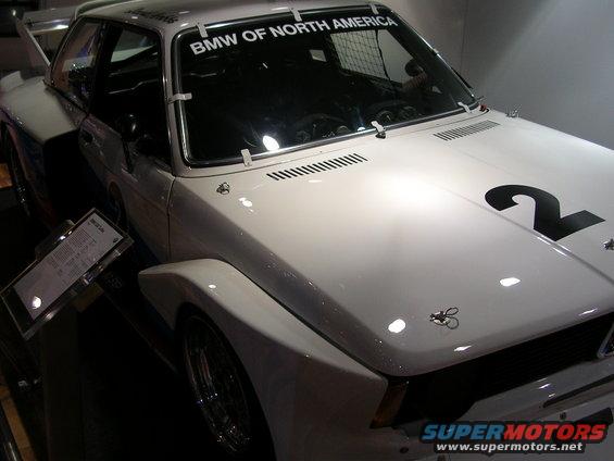 White BMW race car with number 2 on hood and BMW of North America on windshield