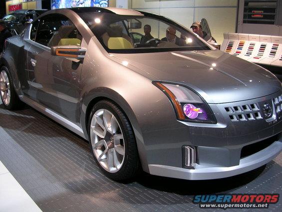 Silver concept car with unique grille and headlights