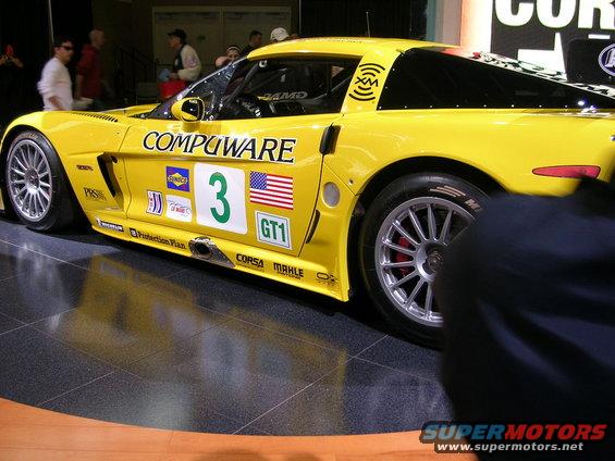 Yellow race car with 'COMPUWARE' and '3' decals, side view
