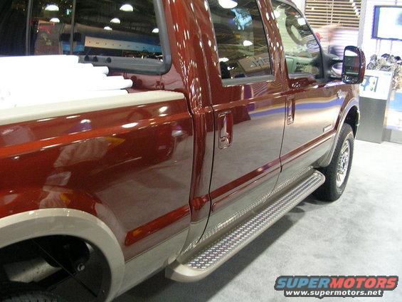 Red pickup truck side view with running boards