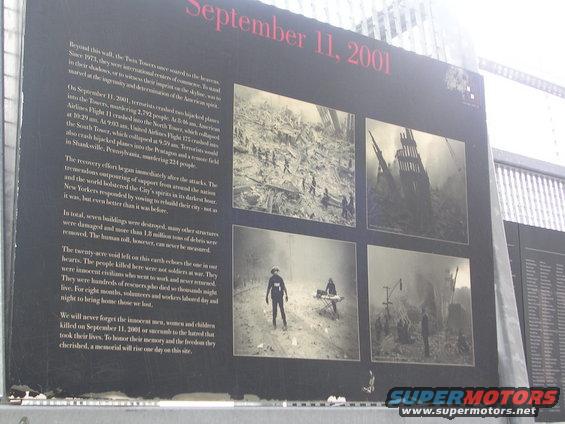 Memorial display about September 11, 2001, with text and four black and white photographs of the event