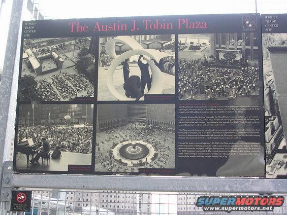 Photo display about the Austin J. Tobin Plaza at the World Trade Center site, showing crowds, a sculpture, and a fountain