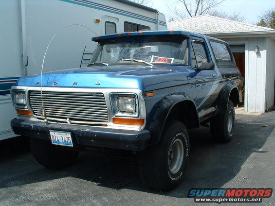 Blue 1979 Ford Bronco with "FOR SALE" sign in window