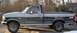 1992 Ford F-150 - Side view of a 1992 Ford F-150 pickup truck with 4x4 badging.