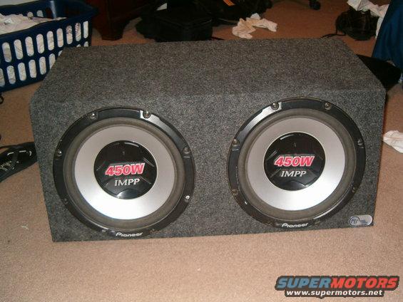 Dual Pioneer subwoofers in a carpeted box, each rated at 450W IMPP