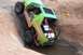 1990 Ford Bronco - This heavily modified off-road vehicle navigates a challenging rocky terrain.