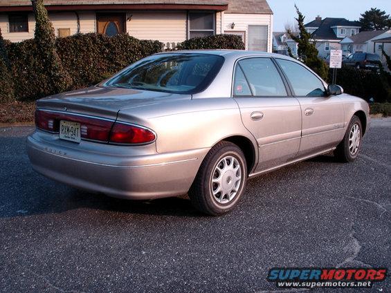 Gold 1997 Buick Century sedan, rear 3/4 view