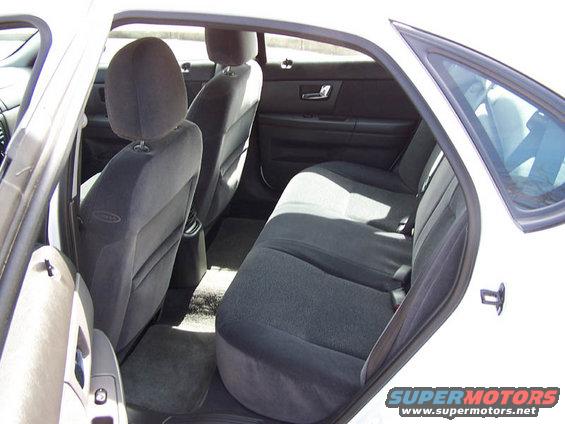 Back seat and door panel of a white car