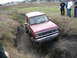 1985 Ford Bronco II - This 1985 Ford Bronco II navigates a challenging muddy terrain, its off-road capabilities.