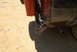 1993 Ford Bronco - Close-up of a vehicle's rear, showing the bumper, taillight, and exhaust pipe.