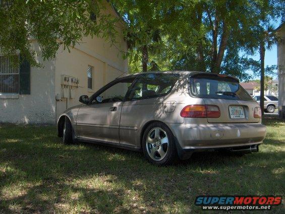 Tan 1993 Honda Civic hatchback parked on grass