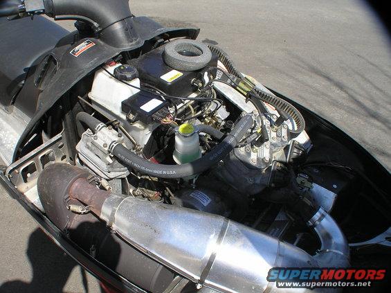 Snowmobile engine with exhaust pipe and air filter